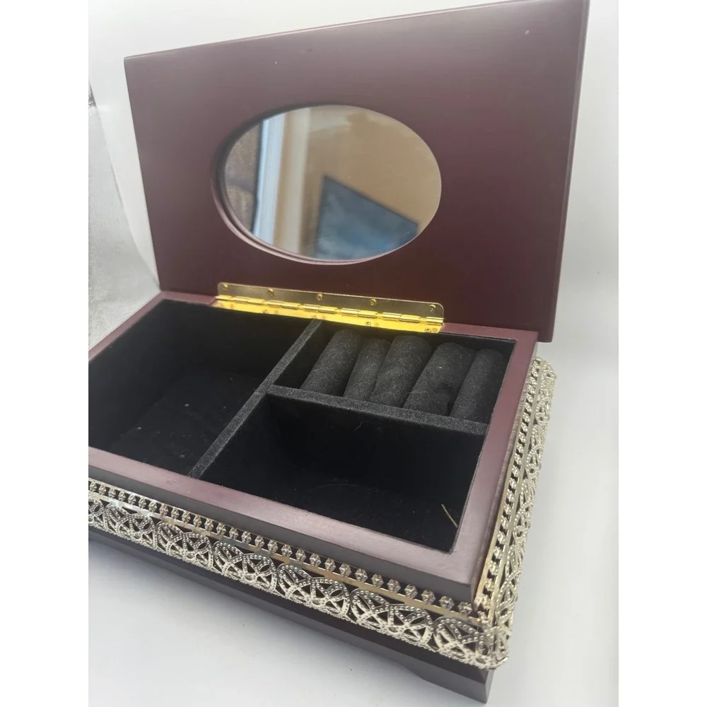 Elegant Wooden Jewelry Box with Ornate Metal Accents and Mirror